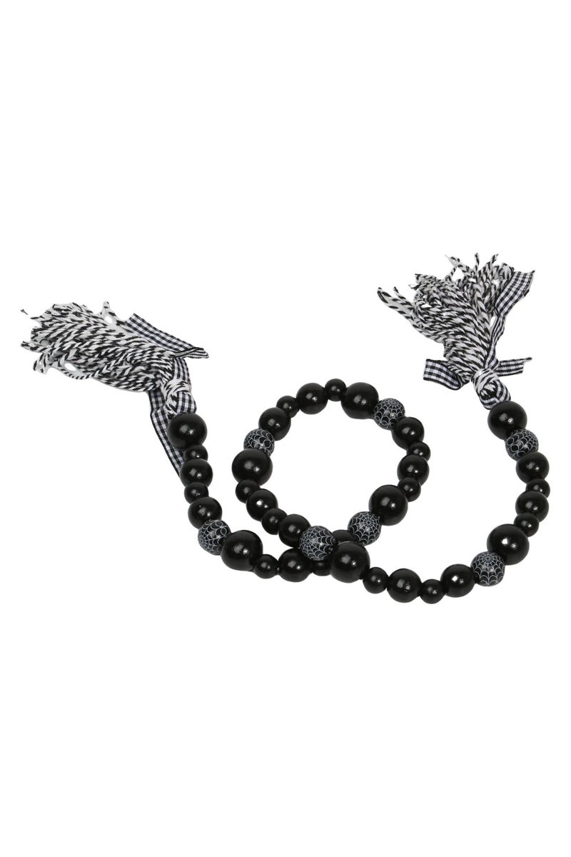 قلادة أنيقة بتصميم فريد مصنوع من خرز أسود لامع بأحجام مختلفة - Image 2