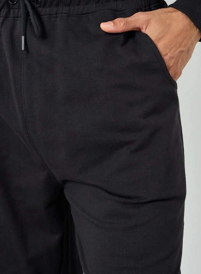 Styli  Men Black Solid Drawstring Joggers for Men | Best Price UAE
