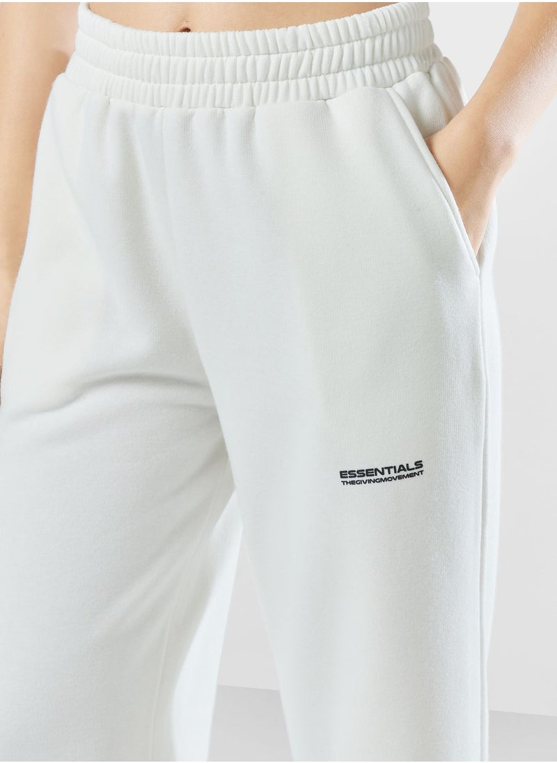 The Giving Movement - Wide Leg Logo Joggers - Image 1