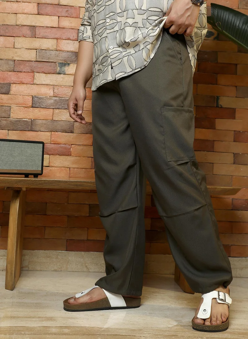 انستافاب بلس Instafab Plus Men's Olive Green Twill-Utility Parachute Trousers | Mid-Rise , Drawcord Hem , Button Closure | Solid Twill Polyester Blend Material For Street & Casual Wear