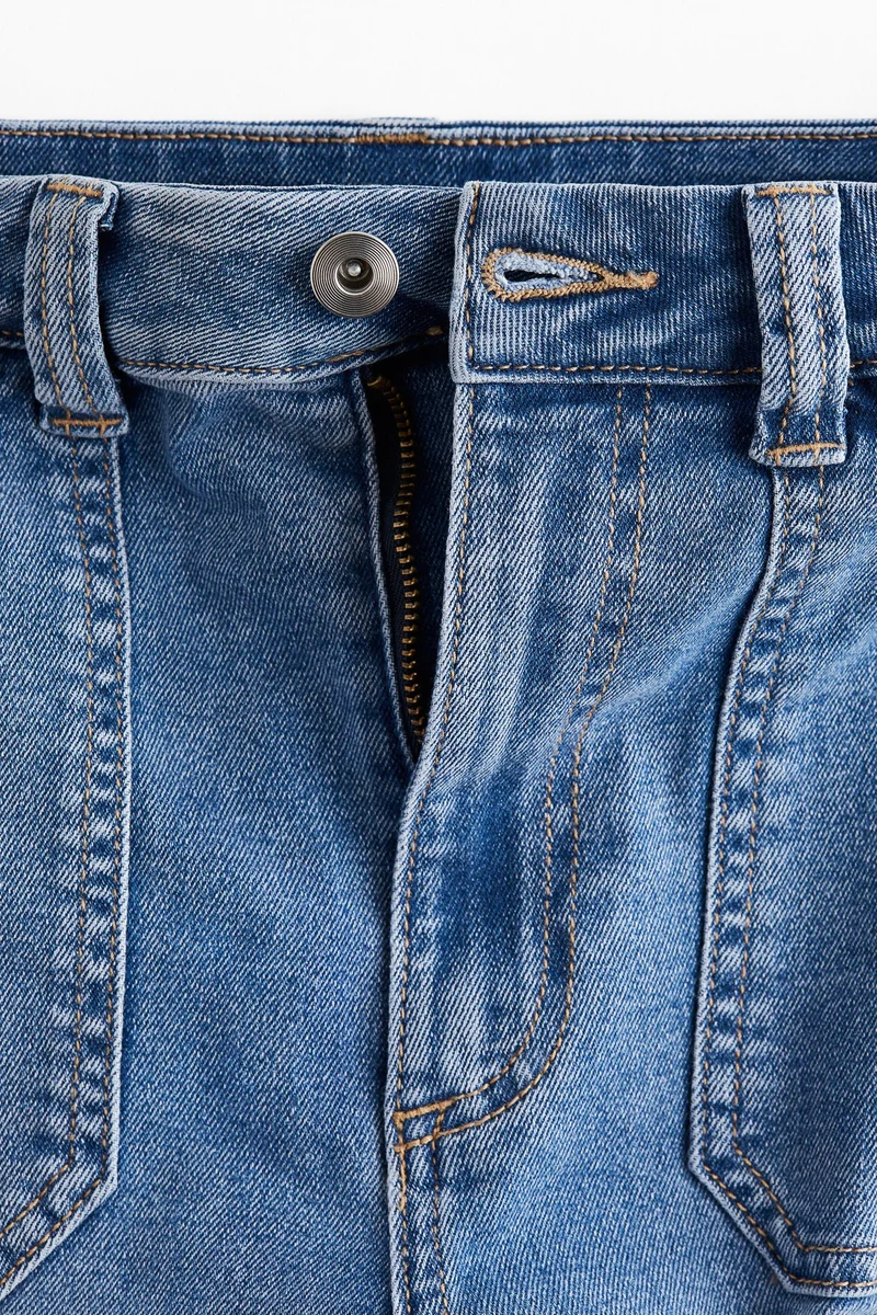 اتش اند ام جينز بحافة سفلية واسعة وخصر عالي