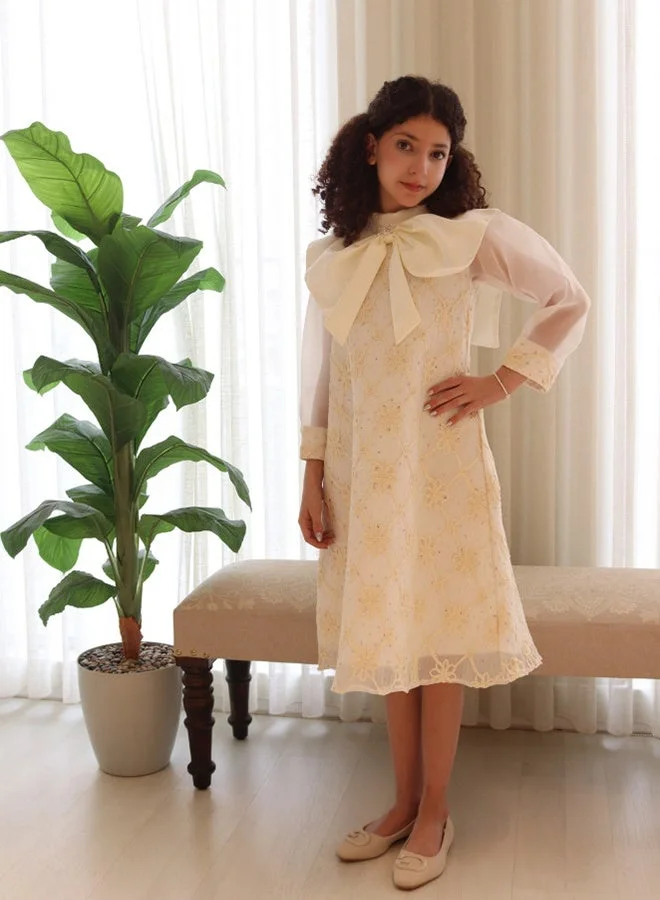 HAWRAA ABAYA Off-White Girls’ Dress with Floral Embroidery, Bow Collar, and Sheer Sleeves