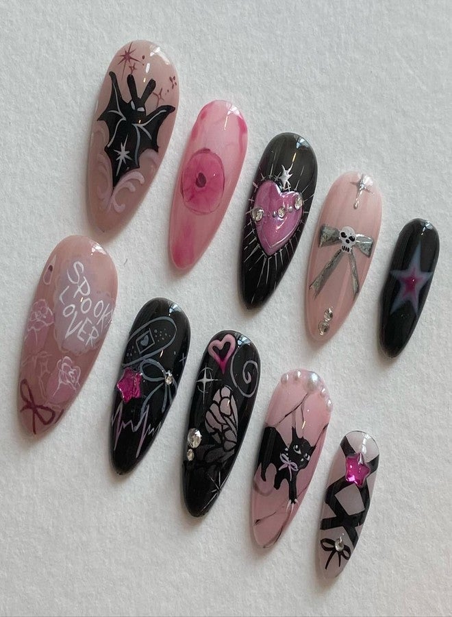 KRTBKR 24Pcs Gothic Press on Nails Medium Almond Fake Nails Cat Bow Heart with Rhinestones Gems Charms Glitter Design Full Cover Y2k Glue on Nails Black Pink False Nails for Women Artificial Acrylic Nails - Image 1