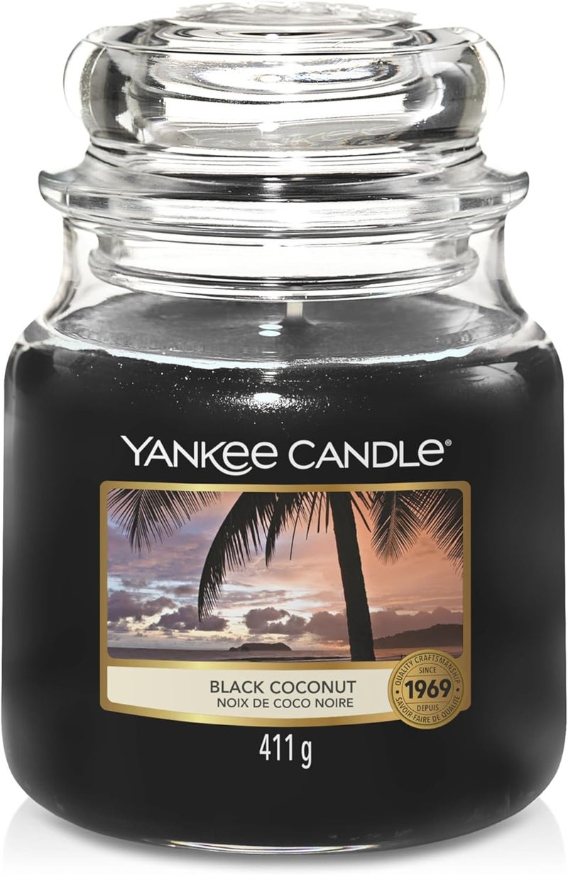 YANKEE CANDLE شمعة يانكي كاندل متوسطة الحجم - جوز الهند الأسود - Image 1