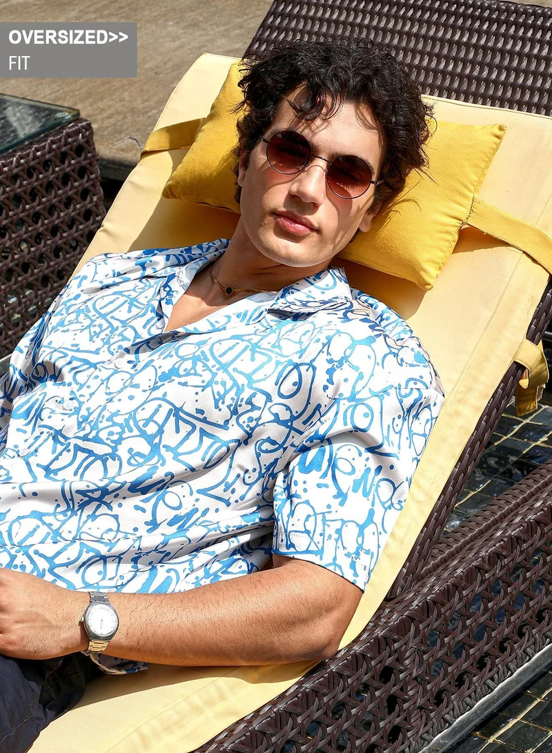 Campus Sutra Campus Sutra Men's Blue & White Graffiti Satin Oversized Shirt For Casual Wear | Cuban Collar | Short Regular Sleeves | Button Closure | Oversized Shirt Crafted With Comfort Fit For Everyday Wear