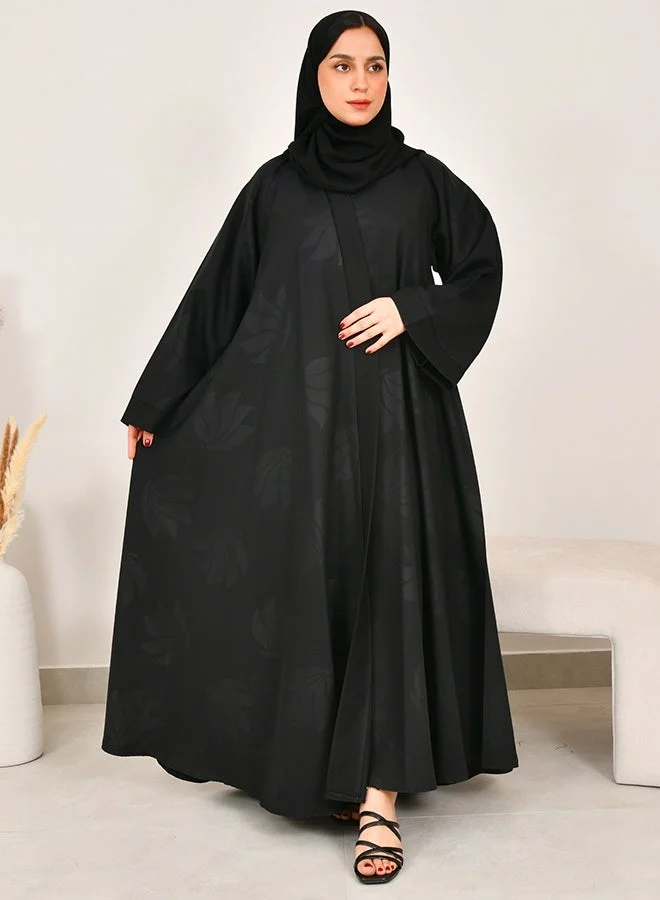 HAWRAA ABAYA Black flared abaya featuring prints across the entire design