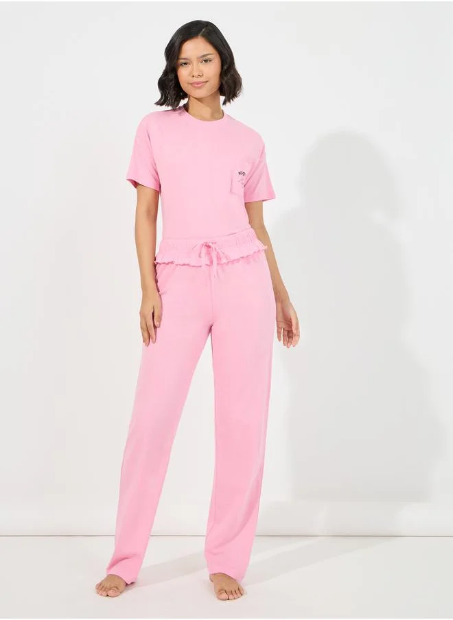 Styli Slogan Pocket Print T-Shirt & Ruffled Waistband Pyjama Set