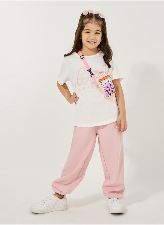 Styli Pack of 3 - Slogan Print T-Shirt, Cuffed Joggers & Sling Bag  - Image 1