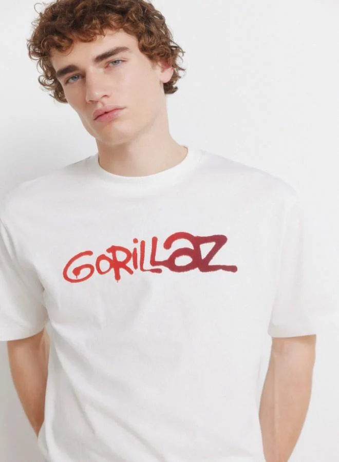 Springfield  Cotton loose fit ribbed round neck short-sleeved T-shirt with Gorillaz prints on the chest and back for Men | Best Price UAE
