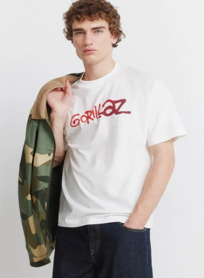 Springfield  Cotton loose fit ribbed round neck short-sleeved T-shirt with Gorillaz prints on the chest and back for Men | Best Price UAE