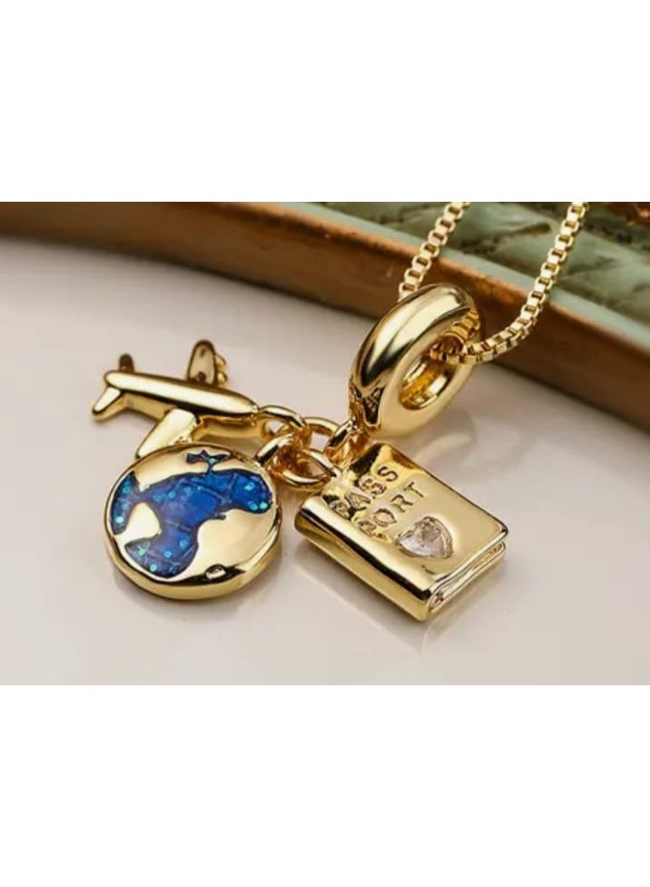 Luxuria A gold necklace with three detailed pendants: an airplane, a blue planet, and a passport. For women. - Image 4