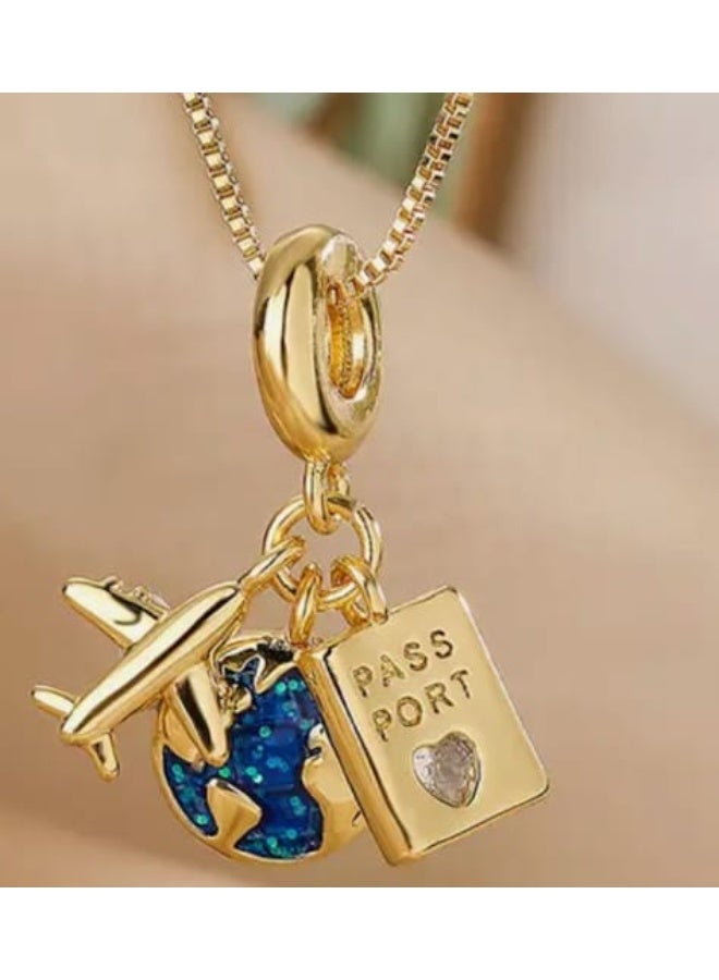 Luxuria A gold necklace with three detailed pendants: an airplane, a blue planet, and a passport. For women. - Image 5