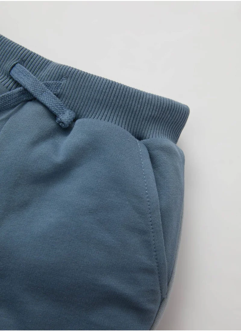 ديفاكتو Regular Fit Slogan Trousers