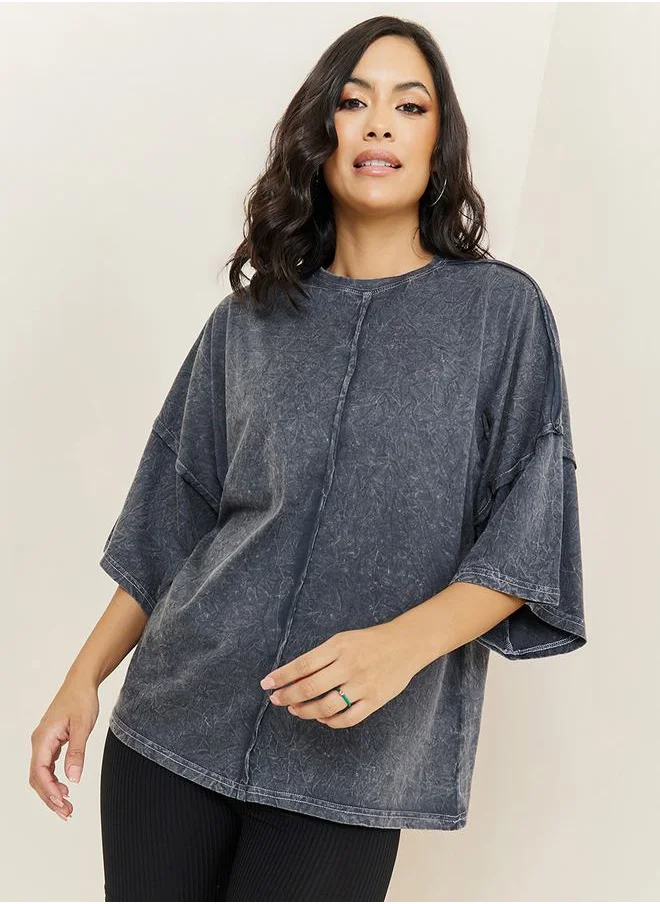 ستايلي Oversized Exaggerated Sleeve Washed T-Shirt with Exposed Seam