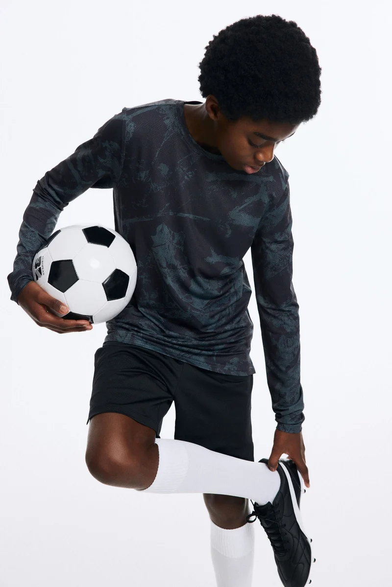 اتش اند ام بلوزة رياضية بأكمام طويلة  من نسيج دراي موف