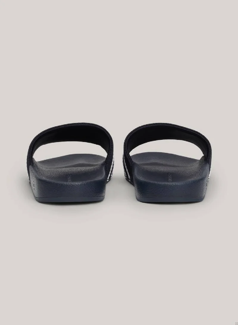 TOMMY HILFIGER Women's Logo Strap Webbing Pool Slides -  Polyester webbing upper, Blue