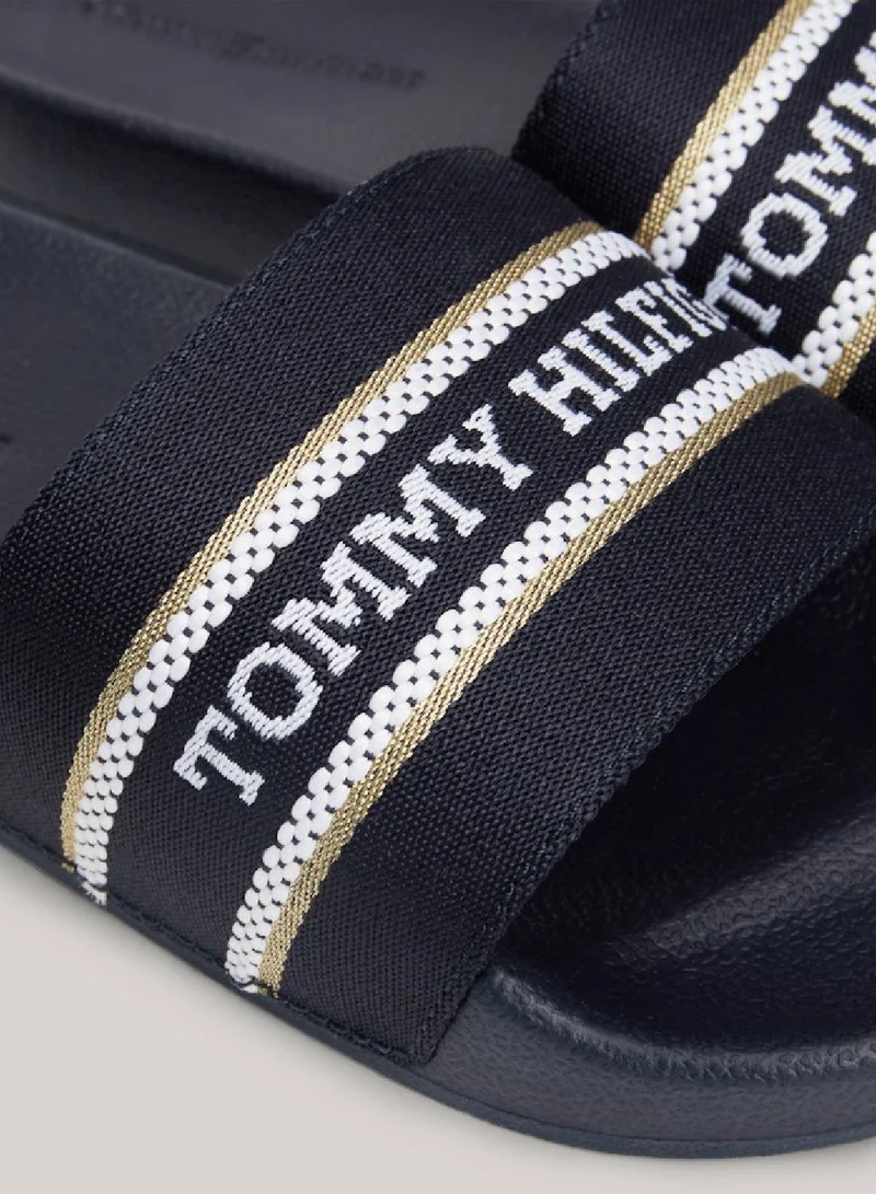 TOMMY HILFIGER Women's Logo Strap Webbing Pool Slides -  Polyester webbing upper, Blue