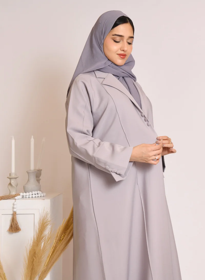 HAWRAA ABAYA Grey blazer style abaya decorated with buttons and a pleat at the back