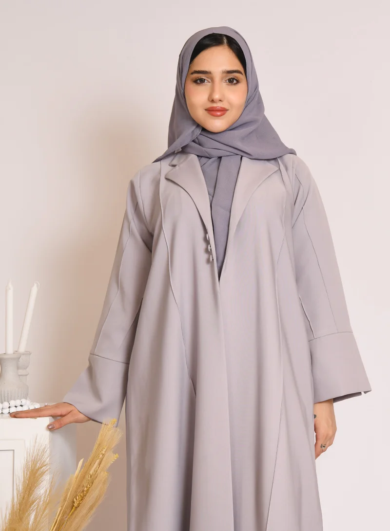 HAWRAA ABAYA Grey blazer style abaya decorated with buttons and a pleat at the back