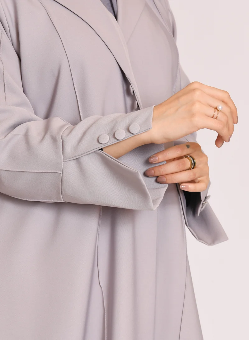 HAWRAA ABAYA Grey blazer style abaya decorated with buttons and a pleat at the back