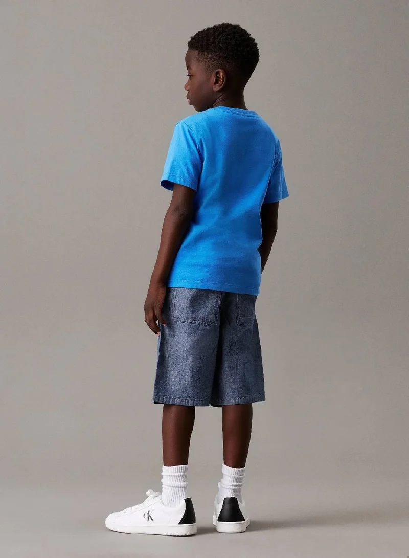 كالفن كلاين جينز شورت من قماش شامبراي