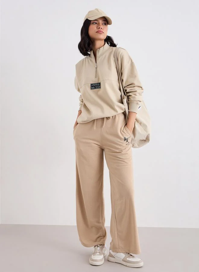 Styli Beige Longline Sweatshirt with Badge Detail