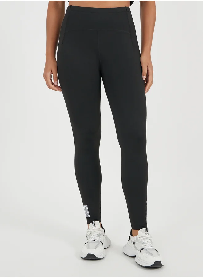 ستايلي Gymspire Edition - Label Dotted Reflective Stripe Detail Leggings