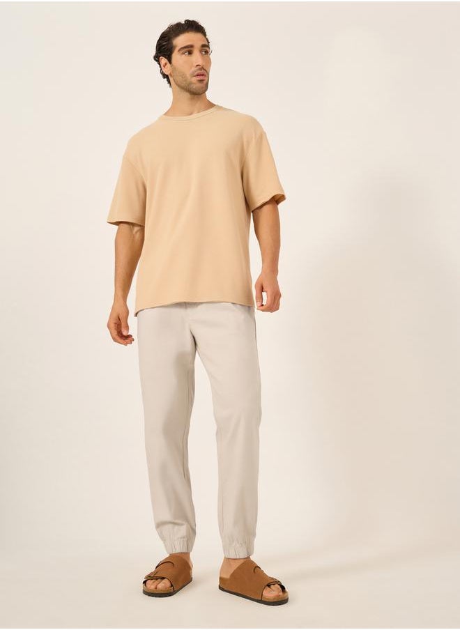 Styli - Solid Relaxed Fit Elasticated Cuffed Joggers with Contrast Drawstring - Image 1