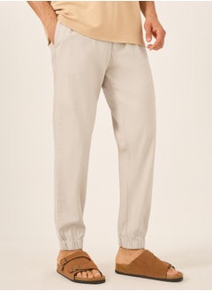Styli Solid Relaxed Fit Elasticated Cuffed Joggers with Contrast Drawstring  - Image 1