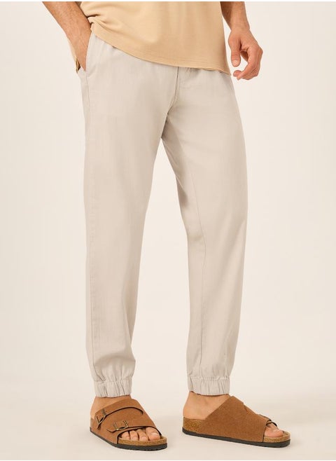 Solid Relaxed Fit Elasticated Cuffed Joggers with Contrast Drawstring