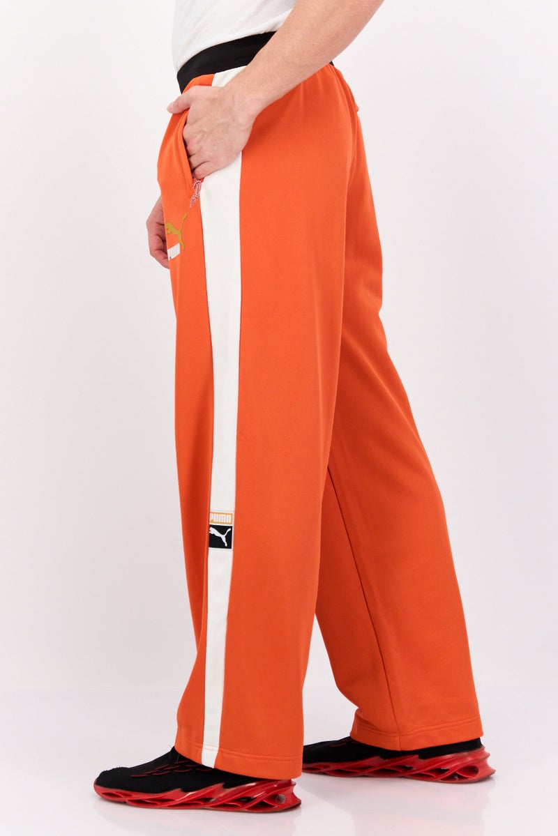 PUMA Men Relaxed Fit Brand Logo Training Track Pants, Orange/White - Image 2