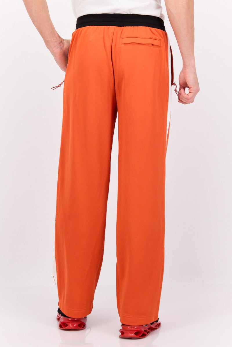 PUMA Men Relaxed Fit Brand Logo Training Track Pants, Orange/White - Image 3