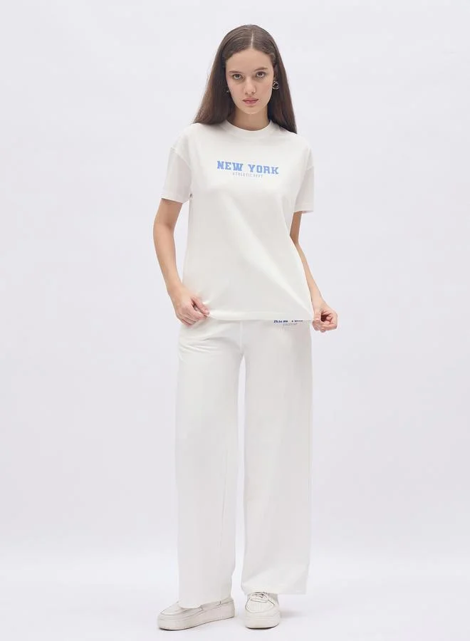 ستايلي Styli Off White Slogan Print Boxy T-Shirt and Wide Leg Joggers Co-Ords