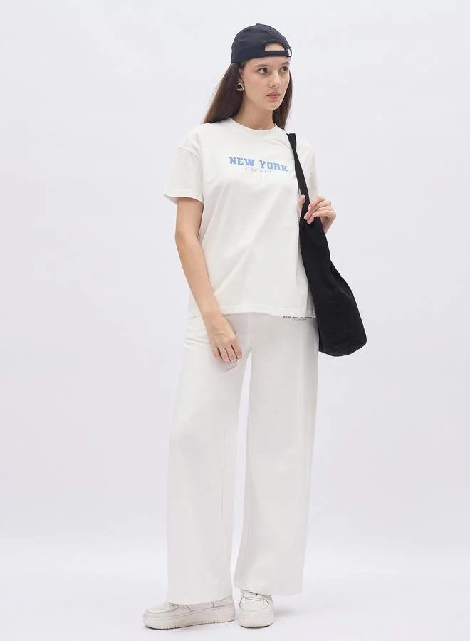 ستايلي Styli Off White Slogan Print Boxy T-Shirt and Wide Leg Joggers Co-Ords