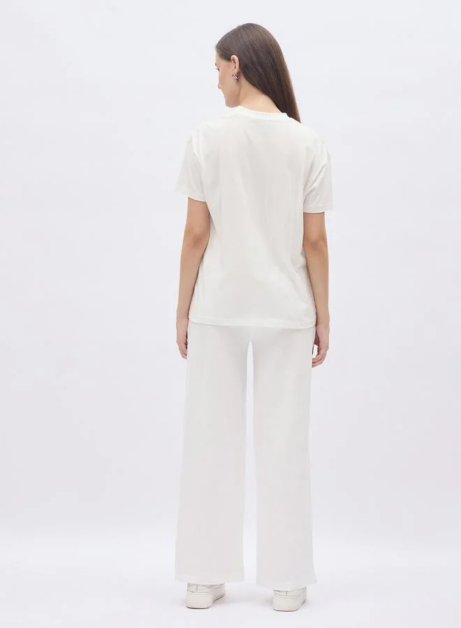 Styli Styli Off White Slogan Print Boxy T-Shirt and Wide Leg Joggers Co-Ords
