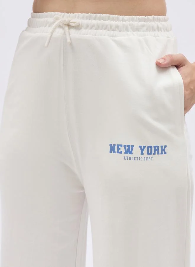 Styli Styli Off White Slogan Print Boxy T-Shirt and Wide Leg Joggers Co-Ords