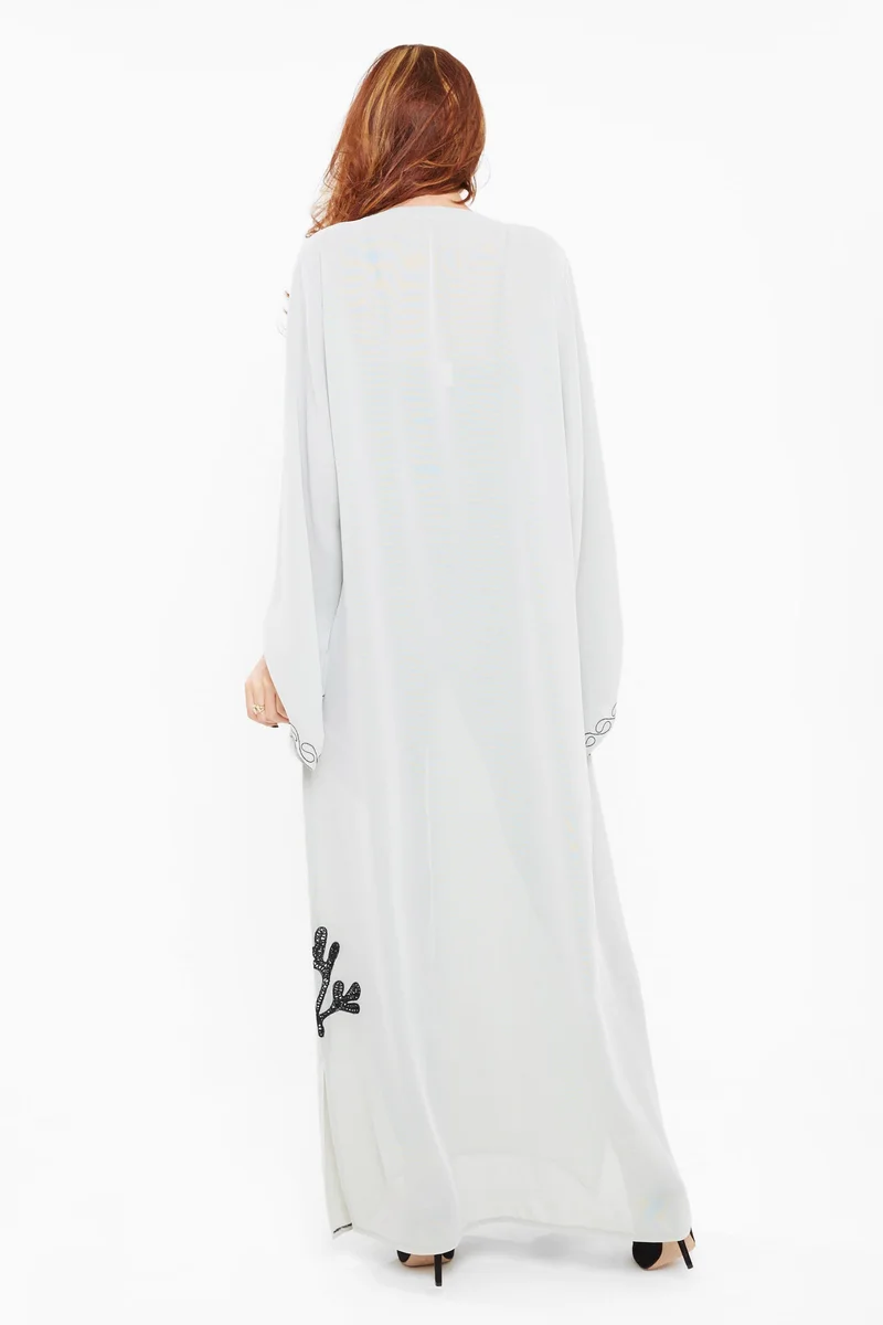 النخبة A rich abaya in grey satin embossed with elegant black prints-AJ439A