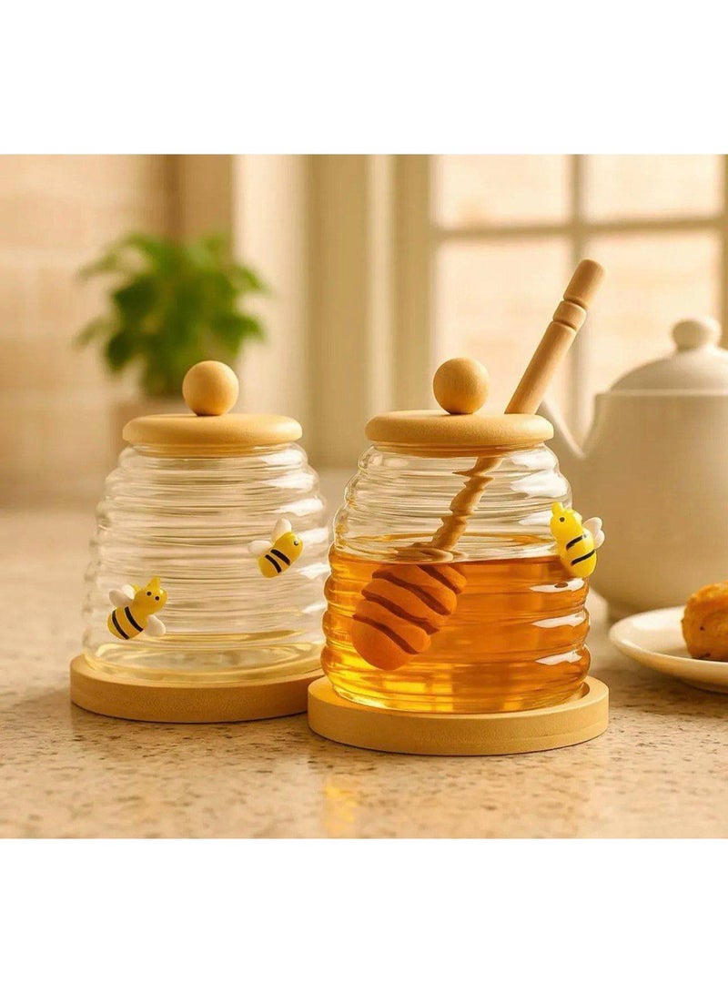 A practical honey jar with an elegant design, it comes with a wooden spoon designed for easy, mess-free honey removal, and a tight-fitting lid. - Image 2