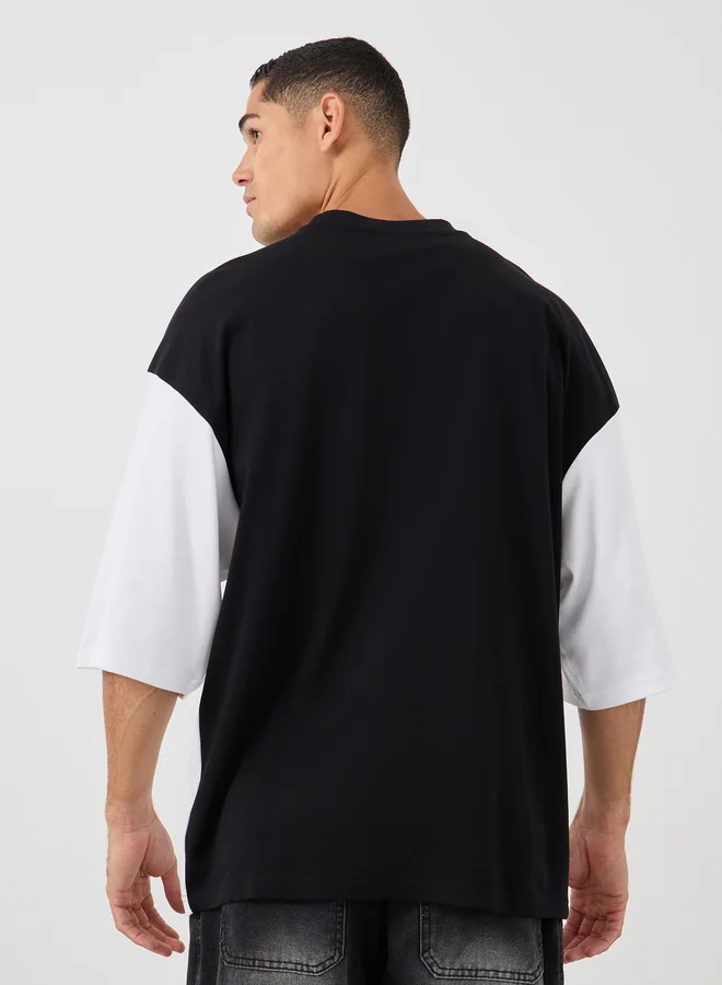 Styli Styli Men Boxy Fit Cut and Sew Panel Printed T-Shirt