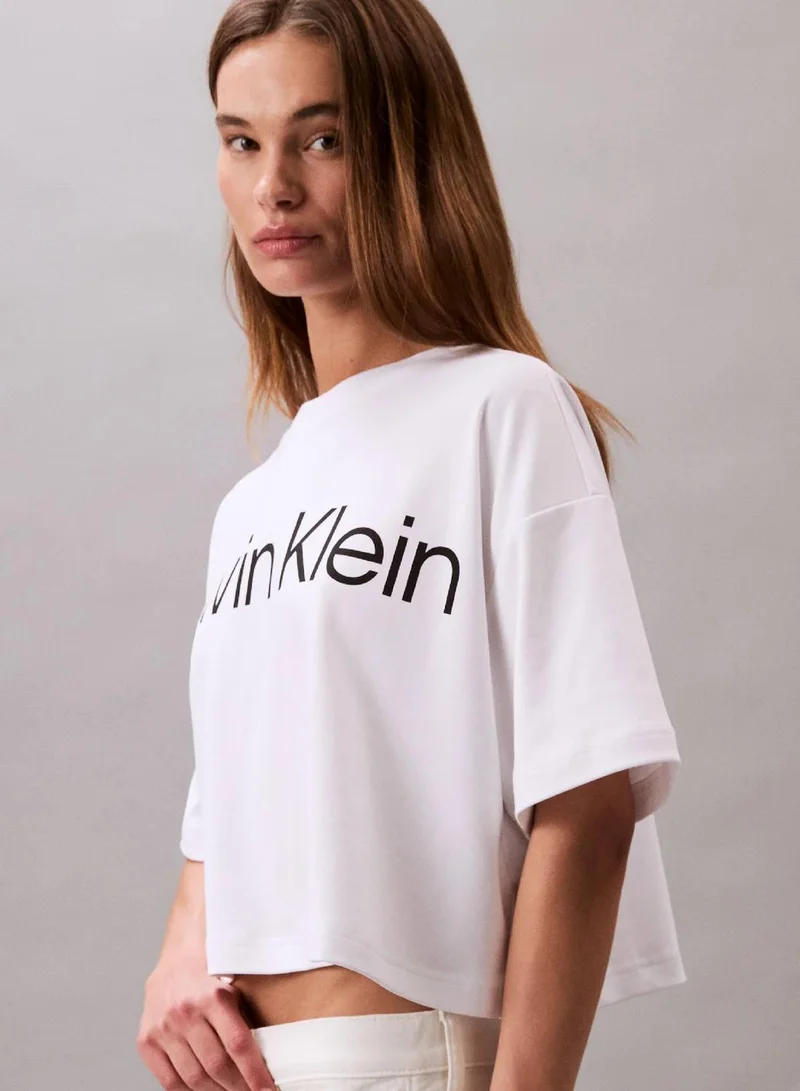 Calvin Klein Brilliant White Logo Graphic Boxy Cropped T-Shirt for Women | Best Price UAE