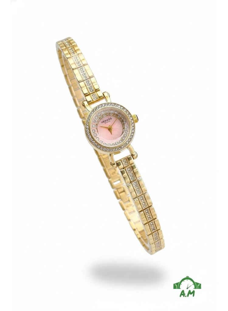 هيرميس ساعة يد نسائية من هيرميس باريس بسوار ذهبي ومينا وردي وإطار مرصع بالكريستال