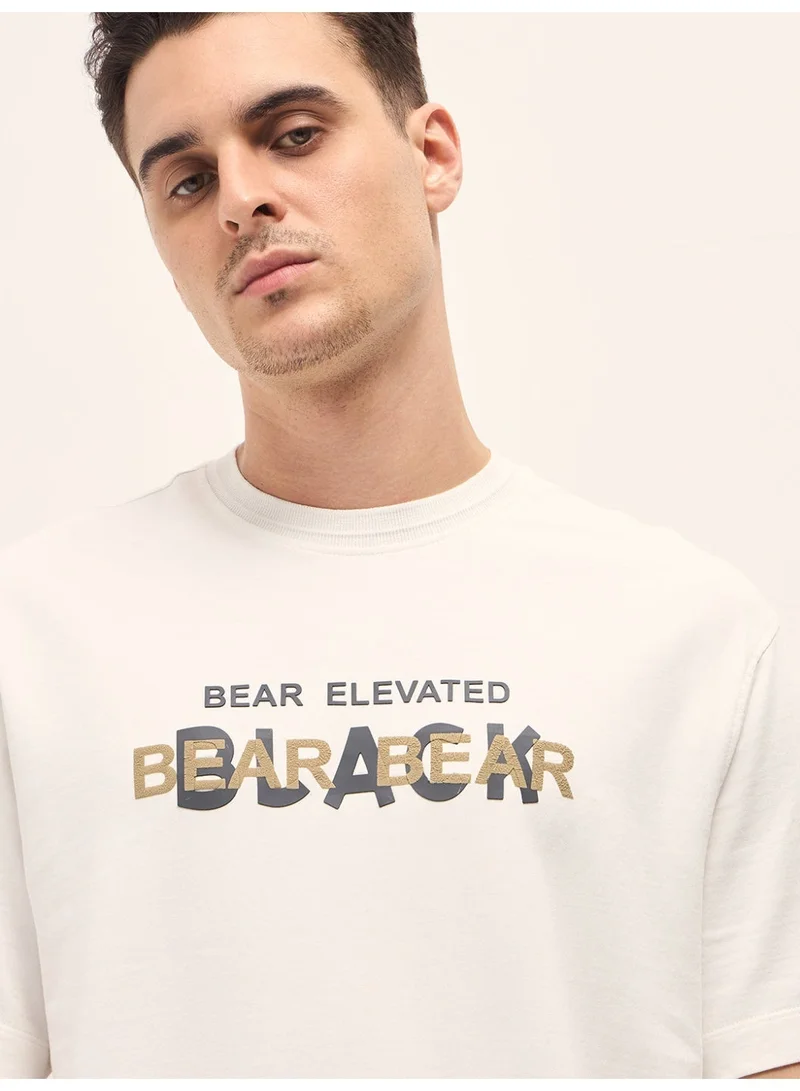 THE BEAR HOUSE  Men's White Graphic Overlapping Text Oversize Crew Neck T-shirt Perfect For Casual Wear, Gym, Travel, Or Layering Stylish And Versatile Essential For Every Wardrobe for Men | Best Price UAE