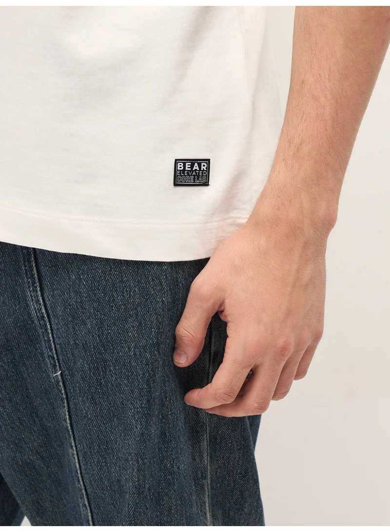 THE BEAR HOUSE  Men's White Graphic Overlapping Text Oversize Crew Neck T-shirt Perfect For Casual Wear, Gym, Travel, Or Layering Stylish And Versatile Essential For Every Wardrobe for Men | Best Price UAE