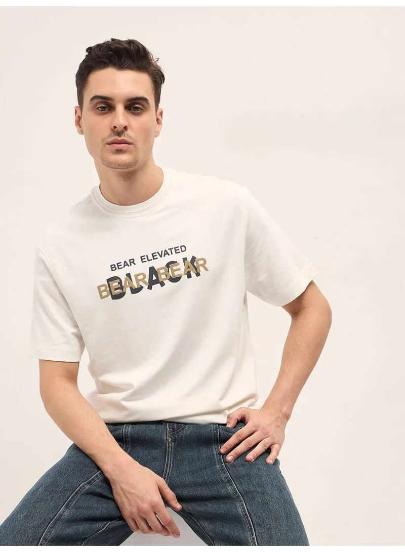 THE BEAR HOUSE  Men's White Graphic Overlapping Text Oversize Crew Neck T-shirt Perfect For Casual Wear, Gym, Travel, Or Layering Stylish And Versatile Essential For Every Wardrobe for Men | Best Price UAE