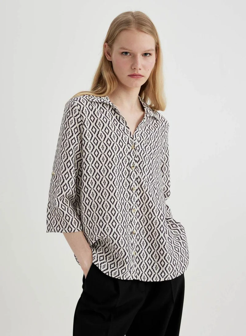 ديفاكتو قميص ذو ياقة قميص وأكمام طويلة