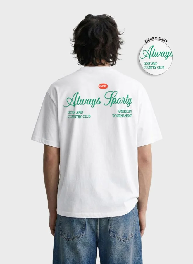 ذا انديان كراج كو Men Relaxed Fit Graphic Printed Crew Neck Half Sleeves T-Shirt