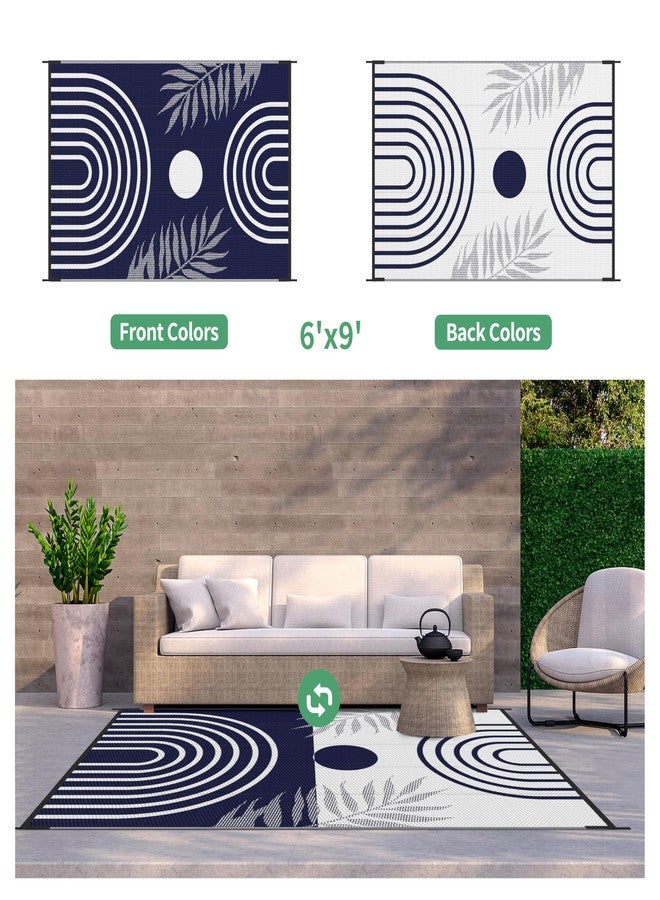 GENIMO سجادة جينيمو الخارجية المقاومة للماء، مقاس 6 × 9 أقدام، مثالية لتنظيف الفناء، قابلة للاستخدام على الوجهين، مصنوعة من قش بلاستيكي خفيف الوزن، مناسبة للتخييم، مناسبة للأماكن الكبيرة مثل السيارات الترفيهية، والحدائق الخلفية، والشرفات، والباحات، والنزهات، والشرفات، متوفرة بألوان الأزرق والأبيض. - Image 4