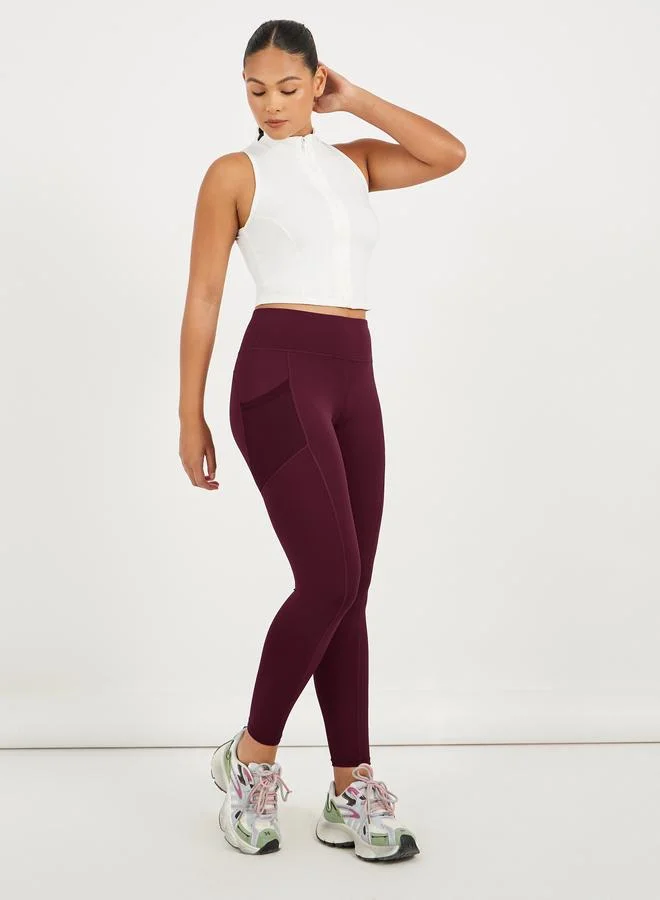 Styli Active maroon Side Mesh Pocket Broad Waistband Leggings for Women | Best Price UAE
