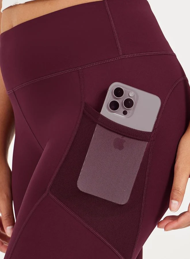 Styli Active maroon Side Mesh Pocket Broad Waistband Leggings for Women | Best Price UAE