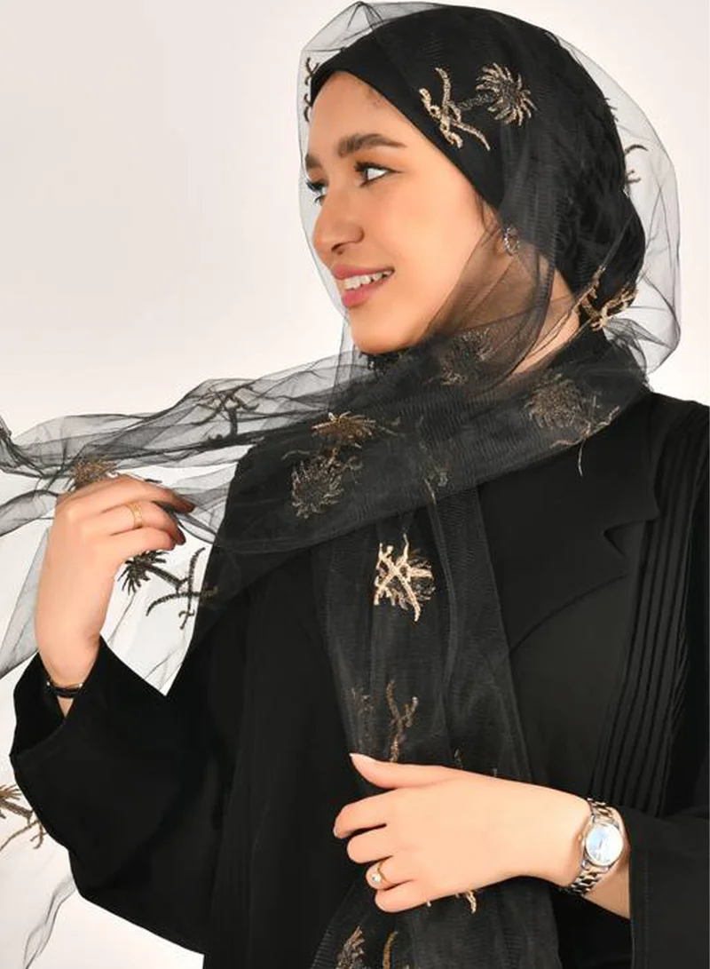HAWRAA ABAYA A black tulle veil fully decorated with two swords and a golden palm tree